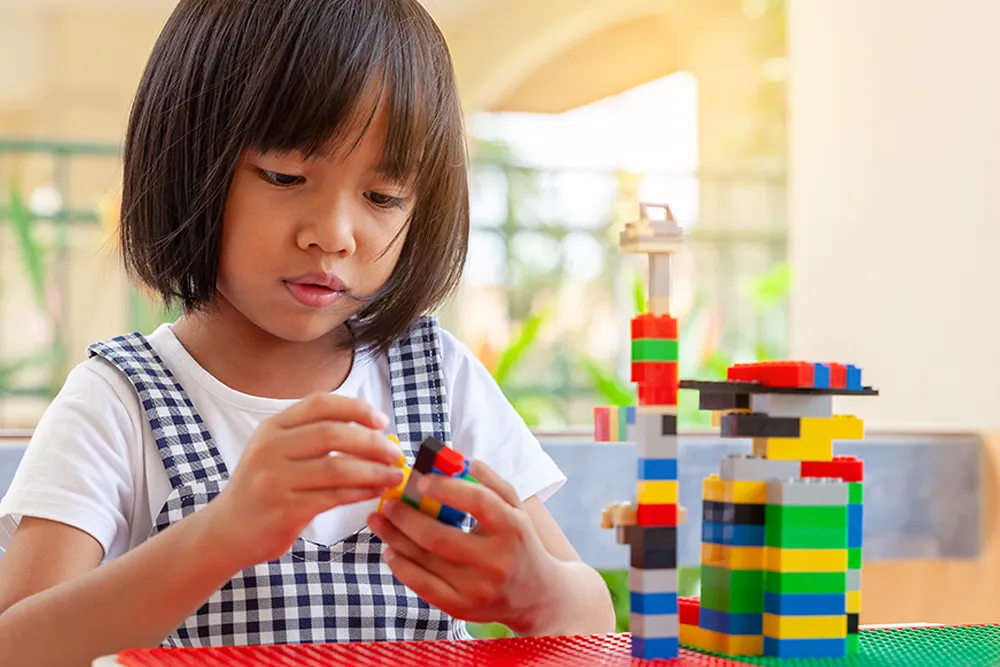 child playing with legos